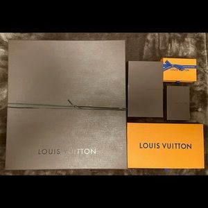 Assorted Louis Vuitton Shopping Bags and Boxes.